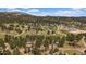 Scenic mountain community with homes nestled among tall trees in a peaceful setting at 29827 Gigi Rd, Evergreen, CO 80439