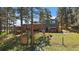 View of backyard, with a lawn, trees, and a fence, offering a serene outdoor space at 29827 Gigi Rd, Evergreen, CO 80439