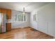 Bright dining area with hardwood floors and view to the exterior at 29827 Gigi Rd, Evergreen, CO 80439