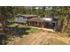 Charming multi-level home with a brick exterior and a convenient covered parking area at 29827 Gigi Rd, Evergreen, CO 80439