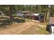 Charming home featuring a brick facade, a lush green yard, and a covered parking area at 29827 Gigi Rd, Evergreen, CO 80439