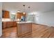 Beautiful kitchen featuring stainless steel appliances, a center island, and ample cabinet space at 29827 Gigi Rd, Evergreen, CO 80439