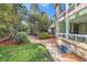 Landscaped backyard includes a patio and a spacious grassy area at 7762 S Eudora Ct, Centennial, CO 80122