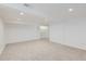Clean, carpeted basement with recessed lighting, and a large storage space for an organized living area at 7762 S Eudora Ct, Centennial, CO 80122