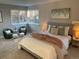 Serene bedroom with a plush bed, ambient lighting, and a picturesque window view for a restful retreat at 7762 S Eudora Ct, Centennial, CO 80122