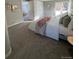 Bright and airy bedroom with a large bed and walk-in closet at 7762 S Eudora Ct, Centennial, CO 80122