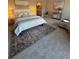 Bedroom featuring a comfortable bed, neutral tones, a decorative rug and contemporary artwork at 7762 S Eudora Ct, Centennial, CO 80122