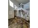 Grand foyer with tile flooring, tall ceilings, white banister staircase, and plenty of natural light at 7762 S Eudora Ct, Centennial, CO 80122