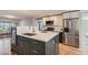 Updated kitchen featuring stainless steel appliances, two sinks and stylish two-tone cabinets at 7762 S Eudora Ct, Centennial, CO 80122