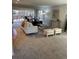 Open living room with comfortable seating, area rug, and large sliding doors to an outdoor space at 7762 S Eudora Ct, Centennial, CO 80122