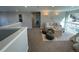 Cozy upstairs living room with plush seating, a soft rug, and large windows showcasing natural light at 7762 S Eudora Ct, Centennial, CO 80122