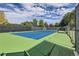 Community tennis court with professional surface, fencing, and shade structure at 7762 S Eudora Ct, Centennial, CO 80122