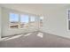 Bedroom featuring a neutral carpet, recessed lighting, and large windows providing great natural light at 631 Sunrise St, Erie, CO 80516