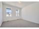 Bedroom featuring neutral carpet and large windows for great natural light at 631 Sunrise St, Erie, CO 80516