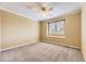Clean, neutral bedroom with carpet floors, ceiling fan, and plantation shutters at 16257 E Belleview Pl, Centennial, CO 80015