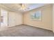 Bedroom with closet space and window featuring plantation shutters at 16257 E Belleview Pl, Centennial, CO 80015