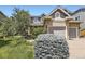 Charming home with manicured lawn and landscaped garden at 16257 E Belleview Pl, Centennial, CO 80015
