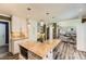 Open concept kitchen with an island and adjacent living area at 16257 E Belleview Pl, Centennial, CO 80015