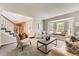 Inviting living room with bay window and neutral decor at 16257 E Belleview Pl, Centennial, CO 80015