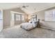 Spacious primary bedroom with vaulted ceiling, bay window and neutral decor at 16257 E Belleview Pl, Centennial, CO 80015