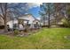 Beautiful backyard view with deck, stone pavers, and lush lawn at 22070 Day Star Dr, Parker, CO 80138