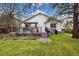 Home's backyard with a deck and manicured lawn at 22070 Day Star Dr, Parker, CO 80138