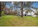 Home's backyard with a deck, manicured lawn and garden at 22070 Day Star Dr, Parker, CO 80138