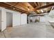 Spacious unfinished basement with exposed ceiling and concrete flooring at 22070 Day Star Dr, Parker, CO 80138
