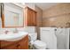 Bathroom with a modern vanity, toilet, and walk in tub at 22070 Day Star Dr, Parker, CO 80138