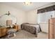 Traditional bedroom with vanity, carpeted floor, and natural light at 22070 Day Star Dr, Parker, CO 80138
