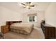 Comfortable bedroom with a ceiling fan, neutral carpet, and a bright window for natural light at 22070 Day Star Dr, Parker, CO 80138