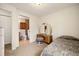 Cozy bedroom featuring a vanity area and adjacent bathroom at 22070 Day Star Dr, Parker, CO 80138