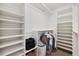 Spacious walk-in closet featuring built-in shelving for ample storage and organization at 22070 Day Star Dr, Parker, CO 80138