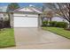 Charming single-Gathering home featuring a two-car garage, stone accents and well-manicured lawn at 22070 Day Star Dr, Parker, CO 80138