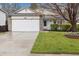 Charming single-Gathering home featuring a two-car garage, stone accents and well-manicured lawn at 22070 Day Star Dr, Parker, CO 80138