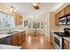 Cozy kitchen with stainless steel appliances, wood cabinets, and a charming breakfast nook at 22070 Day Star Dr, Parker, CO 80138