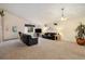 Living room with carpeted floors, vaulted ceilings, and ample natural light at 22070 Day Star Dr, Parker, CO 80138