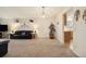 Inviting living room with plush carpeting, modern lighting, and decor shelving at 22070 Day Star Dr, Parker, CO 80138