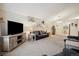 Open concept living room boasts cozy seating, stylish decor, and bright, natural light at 22070 Day Star Dr, Parker, CO 80138