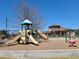 Community playground with slides and swings for Gathering fun and recreation at 22070 Day Star Dr, Parker, CO 80138