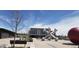 Modern community town center features a stylish building and unique art, creating a vibrant gathering space at 22070 Day Star Dr, Parker, CO 80138