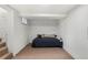 Finished basement bedroom with a twin bed and exposed brick wall at 2929 N Josephine St, Denver, CO 80205