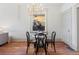 Bright dining area with a glass table and four chairs at 2929 N Josephine St, Denver, CO 80205