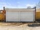 Detached two-car garage with white doors at 2929 N Josephine St, Denver, CO 80205