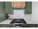 Modern kitchen features gas cooktop and white tile backsplash at 2929 N Josephine St, Denver, CO 80205