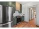 Modern kitchen with green cabinets and stainless steel appliances at 2929 N Josephine St, Denver, CO 80205