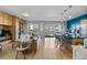 Bright living area with floor-to-ceiling sliding glass doors and bar seating at the kitchen island at 1438 Little Raven St # 310, Denver, CO 80202