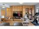 Spacious living room featuring custom cabinetry, display shelves, and an entertainment area at 1438 Little Raven St # 310, Denver, CO 80202