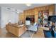 Comfortable living room with custom wood built-ins, media center, and exercise bike for a modern lifestyle at 1438 Little Raven St # 310, Denver, CO 80202