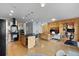 Open-concept living space with island kitchen and custom built-ins, offering ample storage and a sleek design at 1438 Little Raven St # 310, Denver, CO 80202